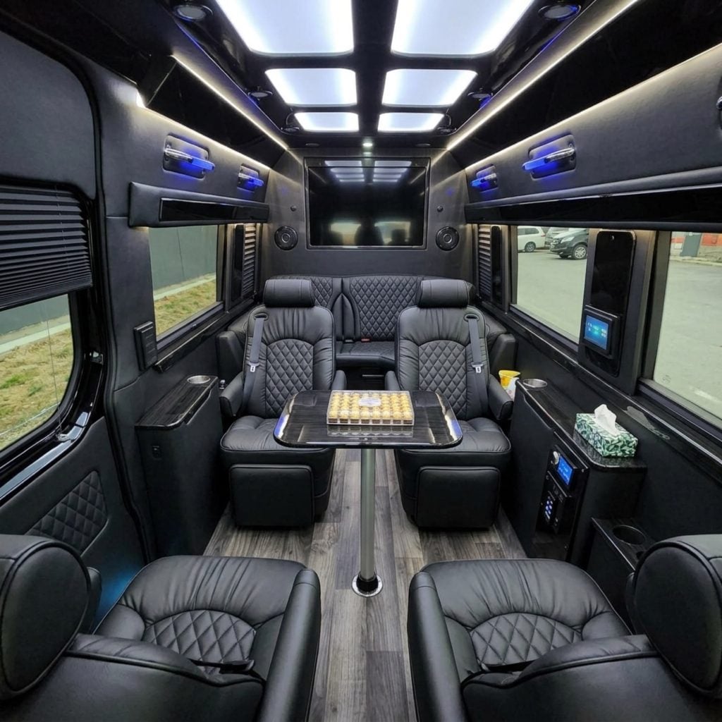 empty vip lux sprinter interior tv table snacks