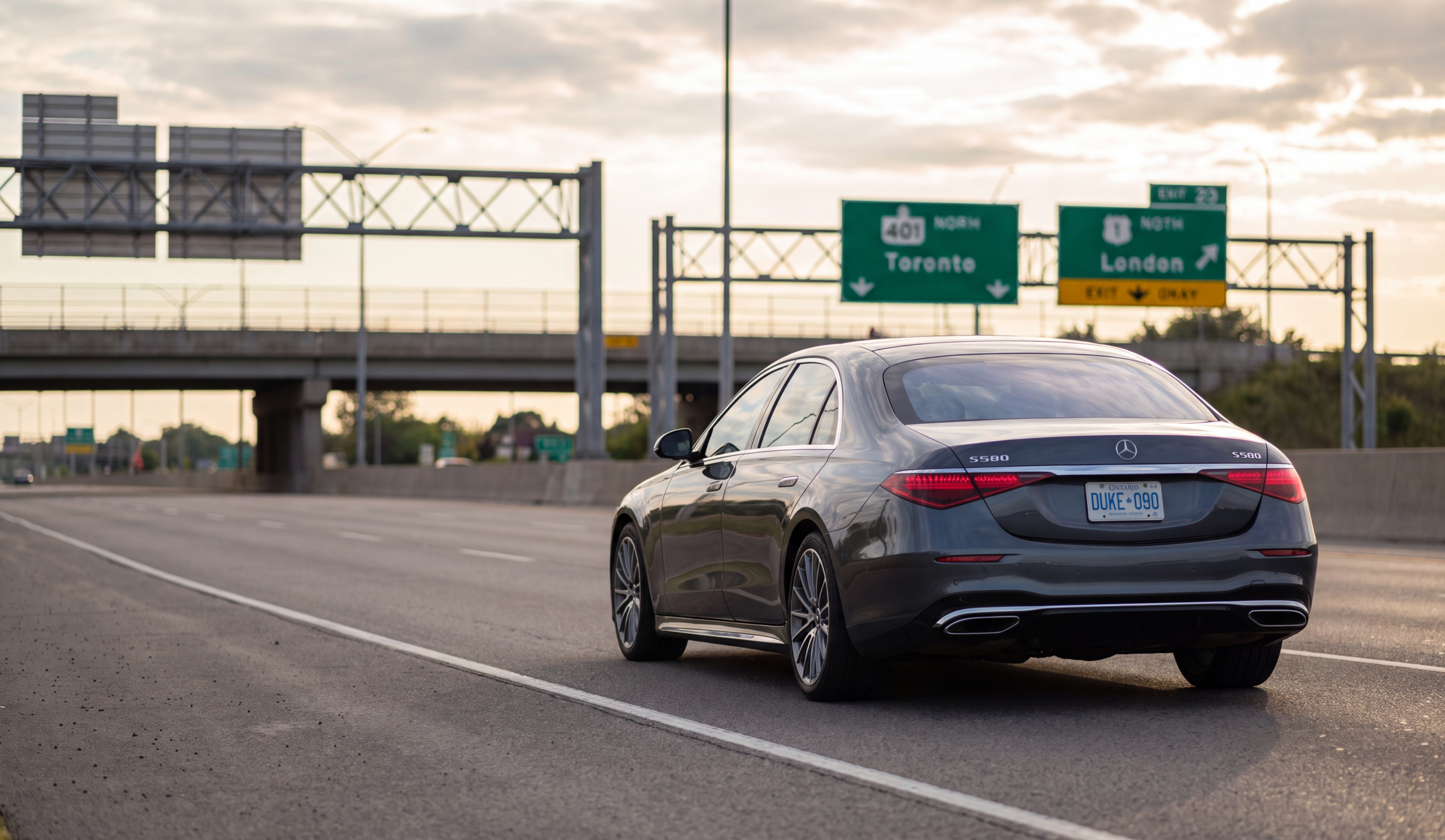 Black Mercedes-Benz S580 sedan traveling on the Highbury Avenue approach to Highway 401 near London Ontario