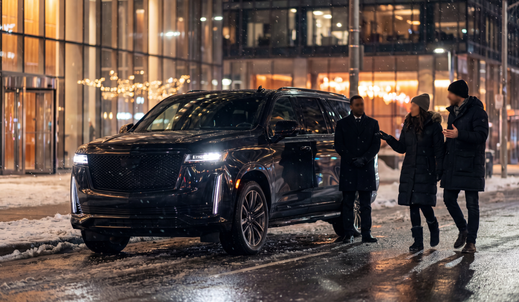 RM Locations 12 Black Escalade parked kerbside in the glowing Toronto arena district on an event night